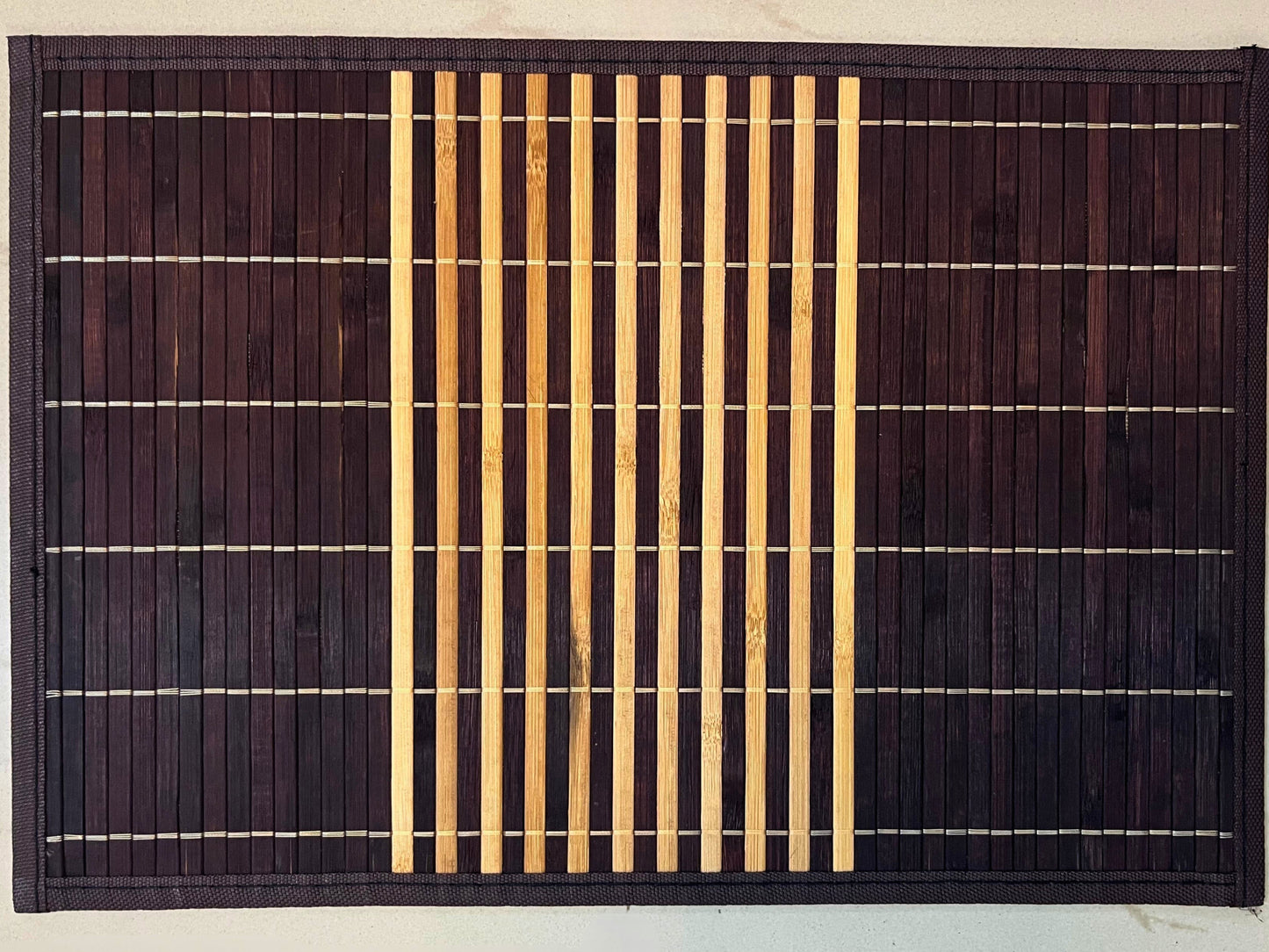 Set of 6 bamboo placemats featuring dark brown and natural horizontal stripes, perfect for an eco-friendly and stylish table setting