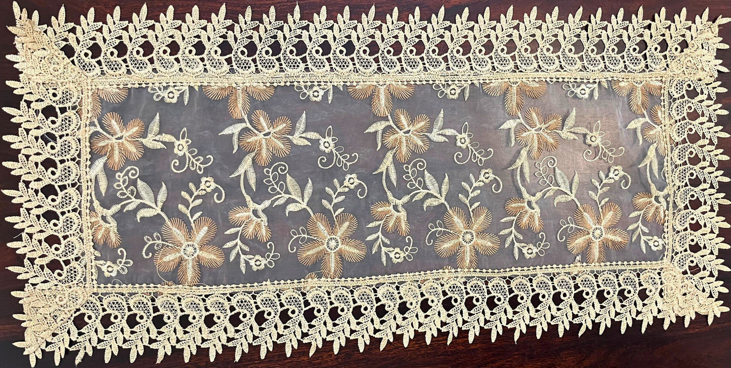 Small vintage lace table runner featuring an intricate floral design, perfect for adding elegance to any table setting