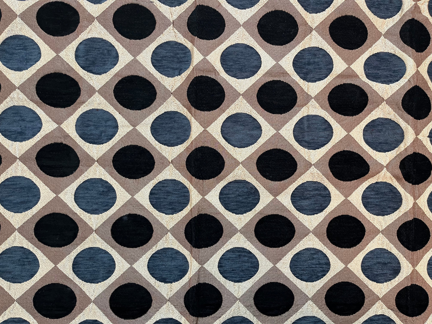 Close-up of premium jacquard table cover showcasing intricate polka dot pattern in navy blue and brown on a luxurious fabric