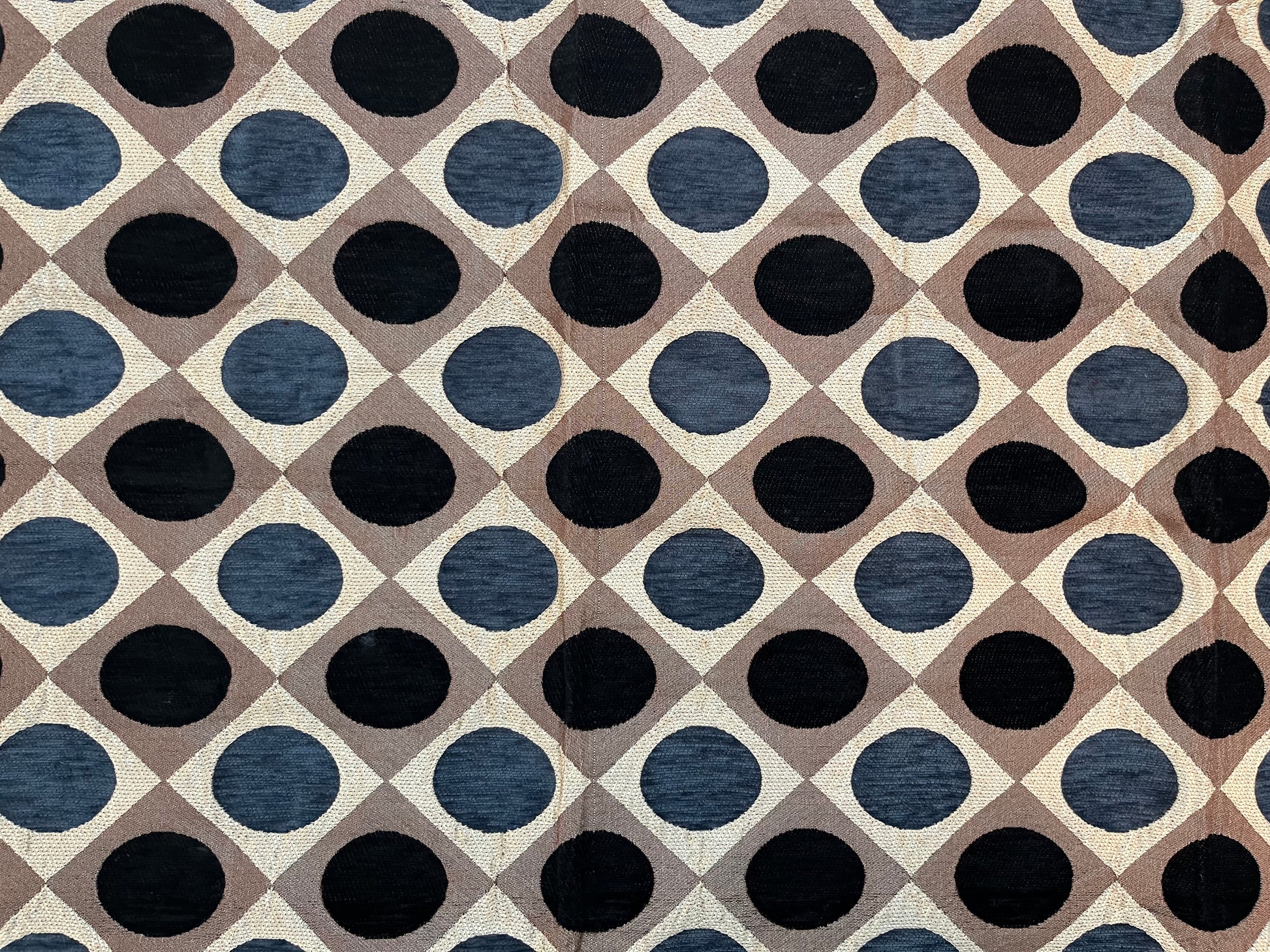 Close-up of premium jacquard table cover showcasing intricate polka dot pattern in navy blue and brown on a luxurious fabric