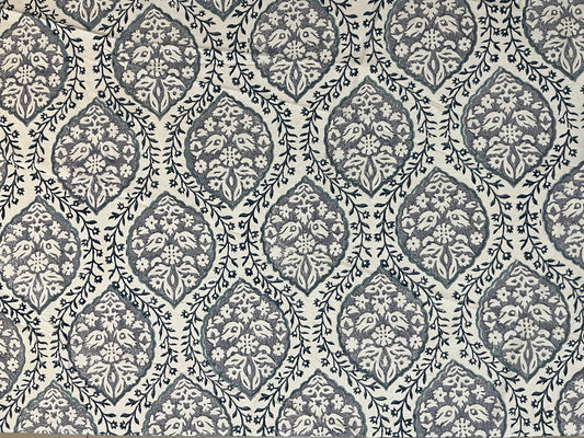 Close-up of round table cover showcasing soft fabric texture and refined grey and white pattern for a classic look