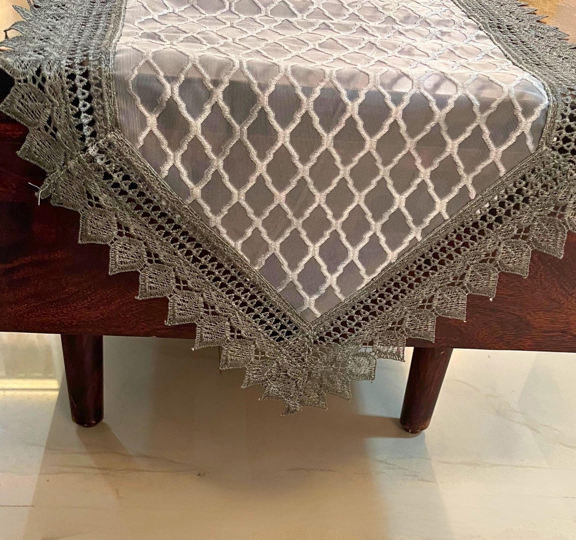 Elegant lace table runner featuring a grey diamond pattern with a decorative crochet border