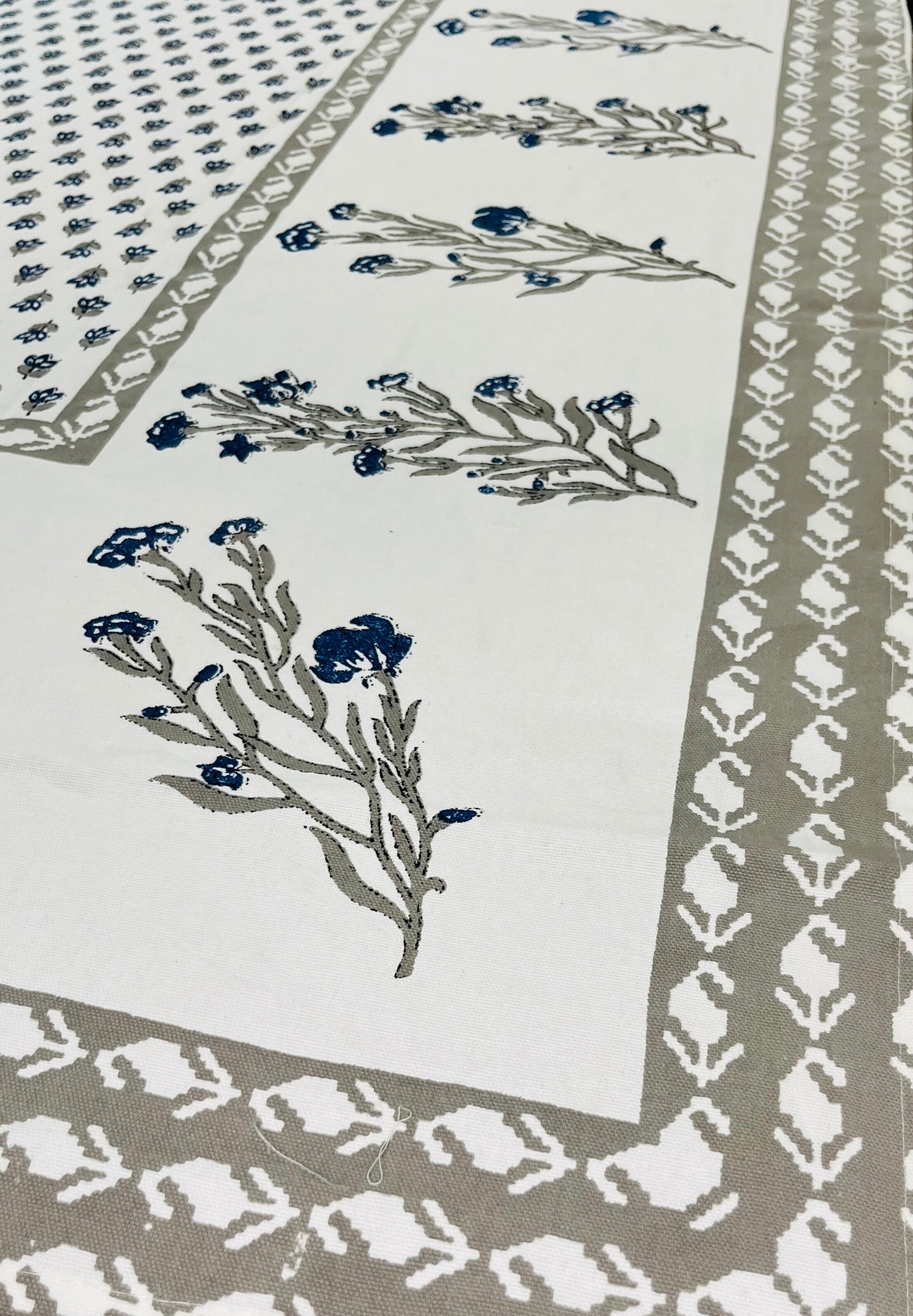 Floral block print cotton tablecloth featuring a traditional blue and grey design