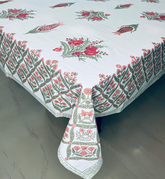 Floral block print dining cotton tablecloth with a traditional red and green design on a white background