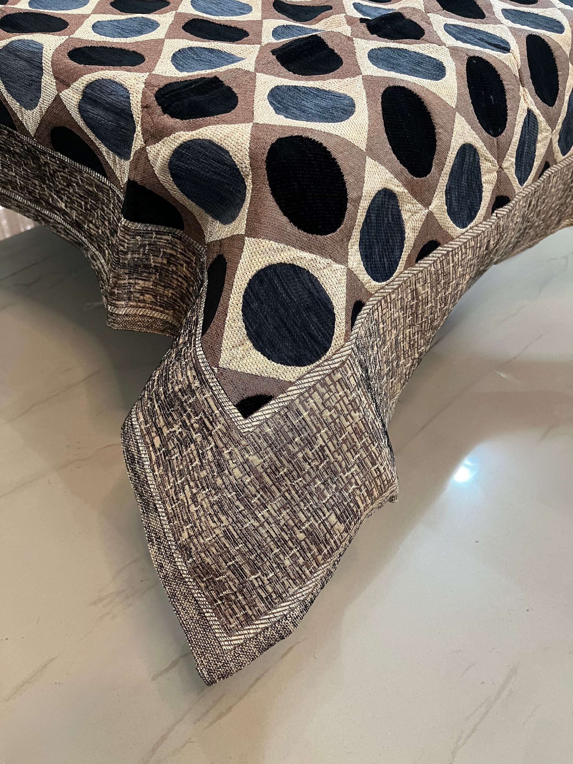 Premium jacquard table cover in navy blue and brown with an elegant polka dot design, perfect for stylish dining spaces