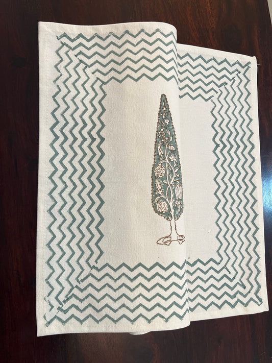 Dining table setup featuring block-printed table mats with a cypress tree motif for a timeless and elegant look