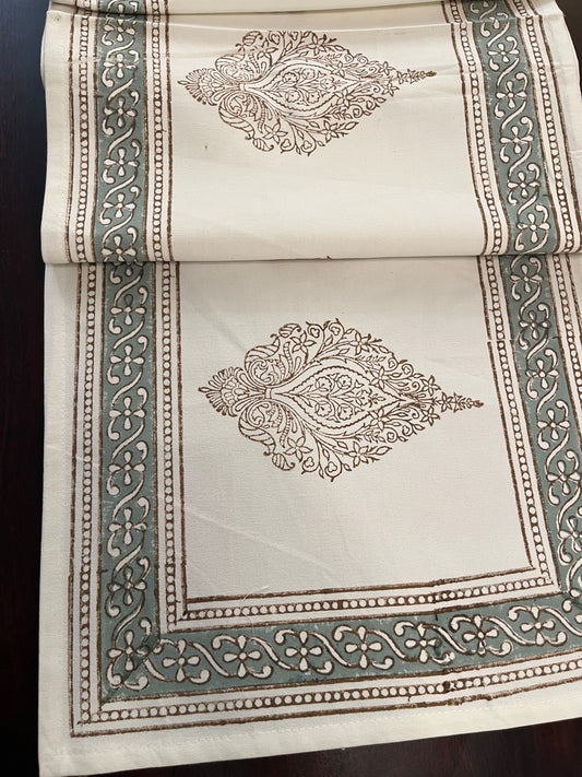 Beautifully styled dining table with a decorative table runner featuring an artisanal block print design
