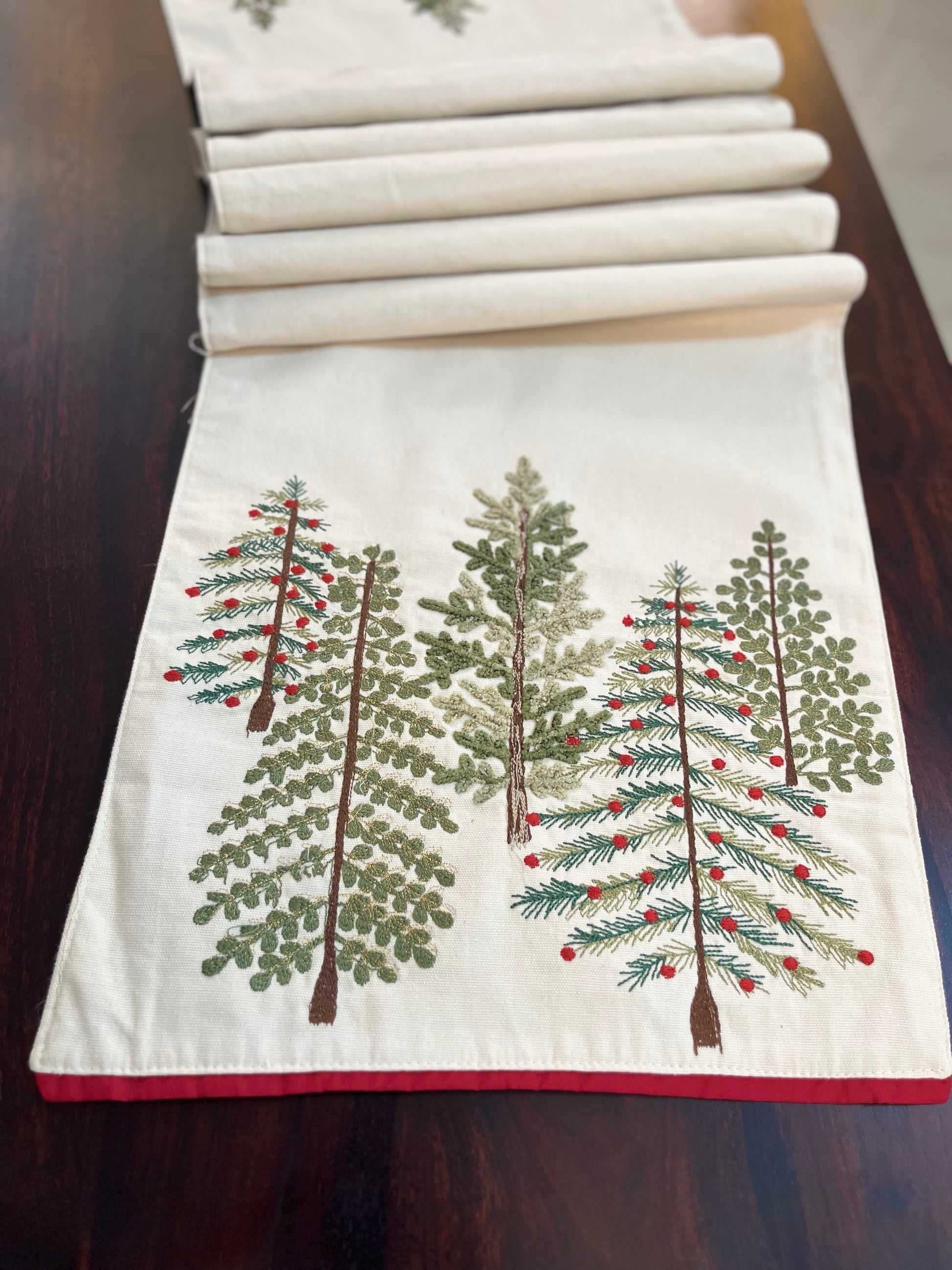 styled-embroidered-table-runner-pine-pattern-red-berries