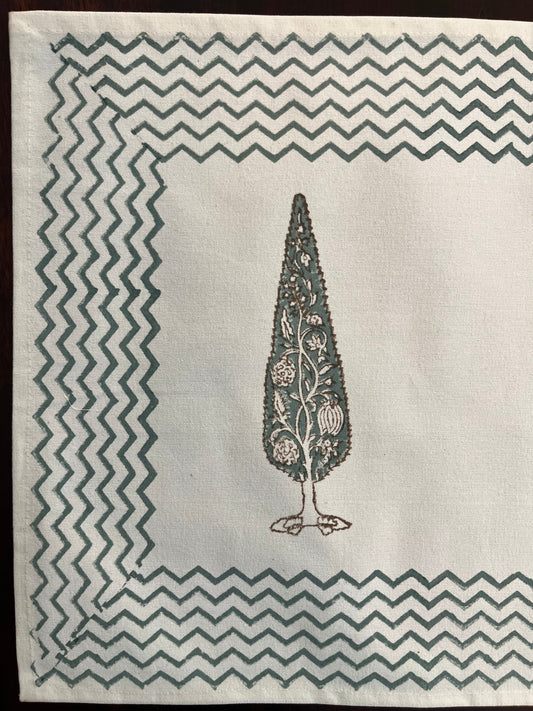 Close-up of block-printed table mat showcasing intricate cypress tree motif with fine detailing