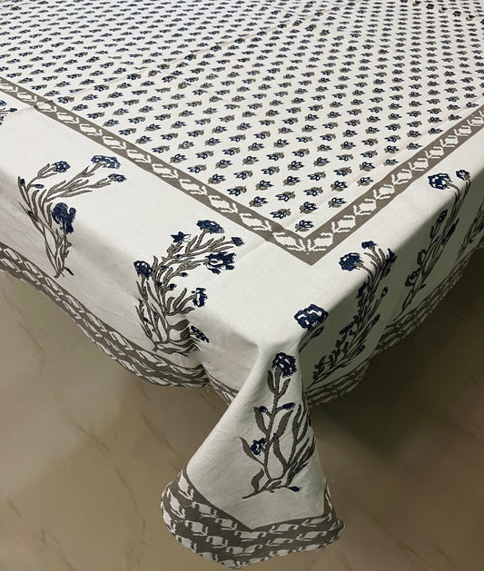 Close-up of floral block print cotton tablecloth showcasing a blue and grey traditional design