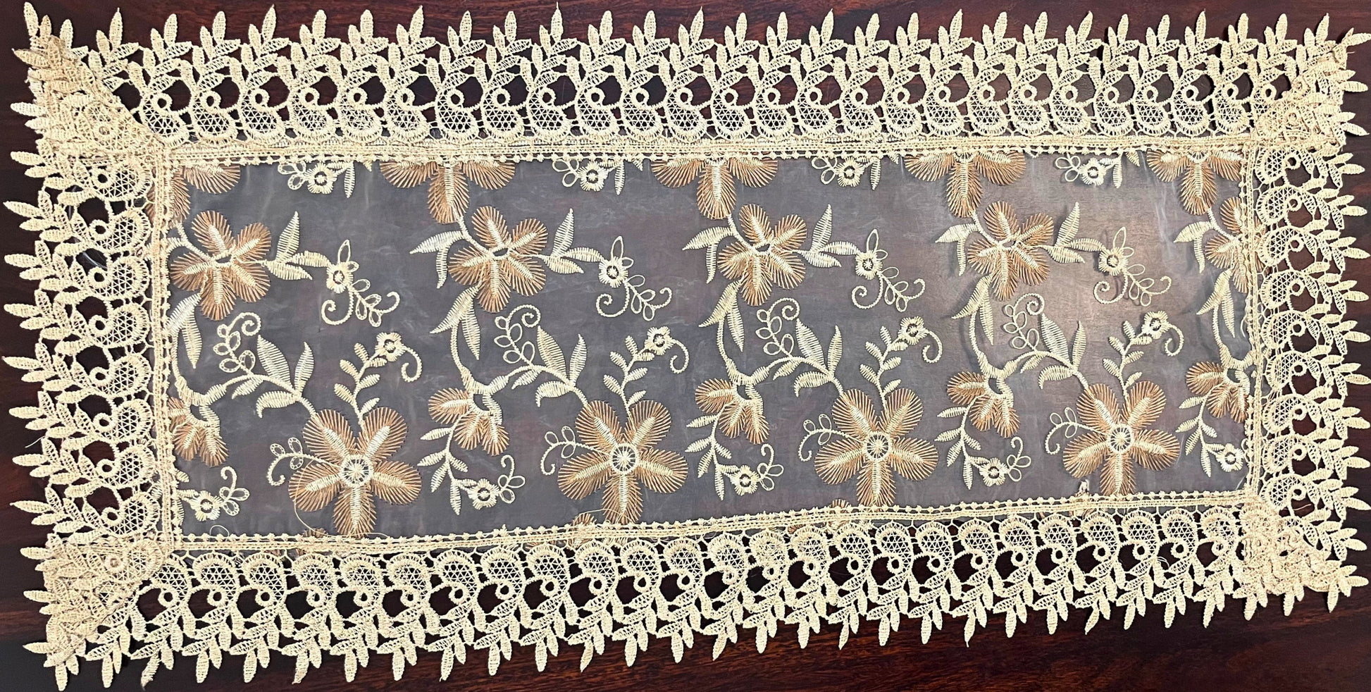 Small vintage lace table runner featuring an intricate floral design, perfect for adding elegance to any table setting